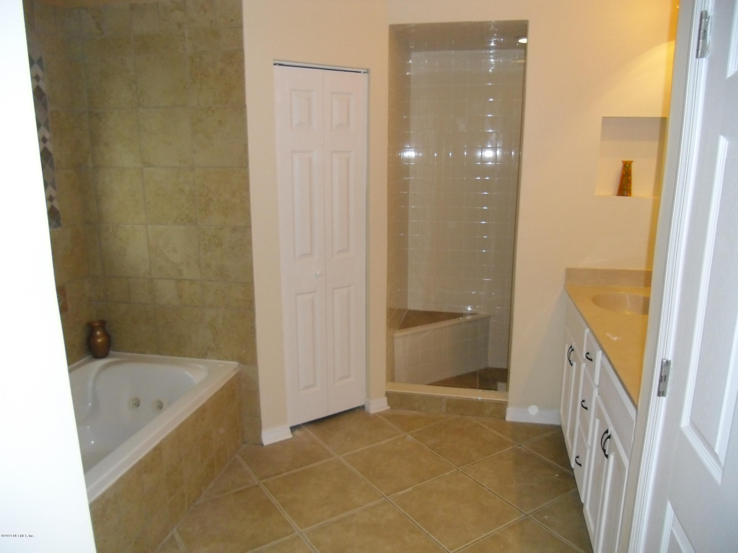 4221 Spring Park Road Jacksonville, FL 32207 - Photo 29 of 56 a bathroom with a bathtub and a shower
