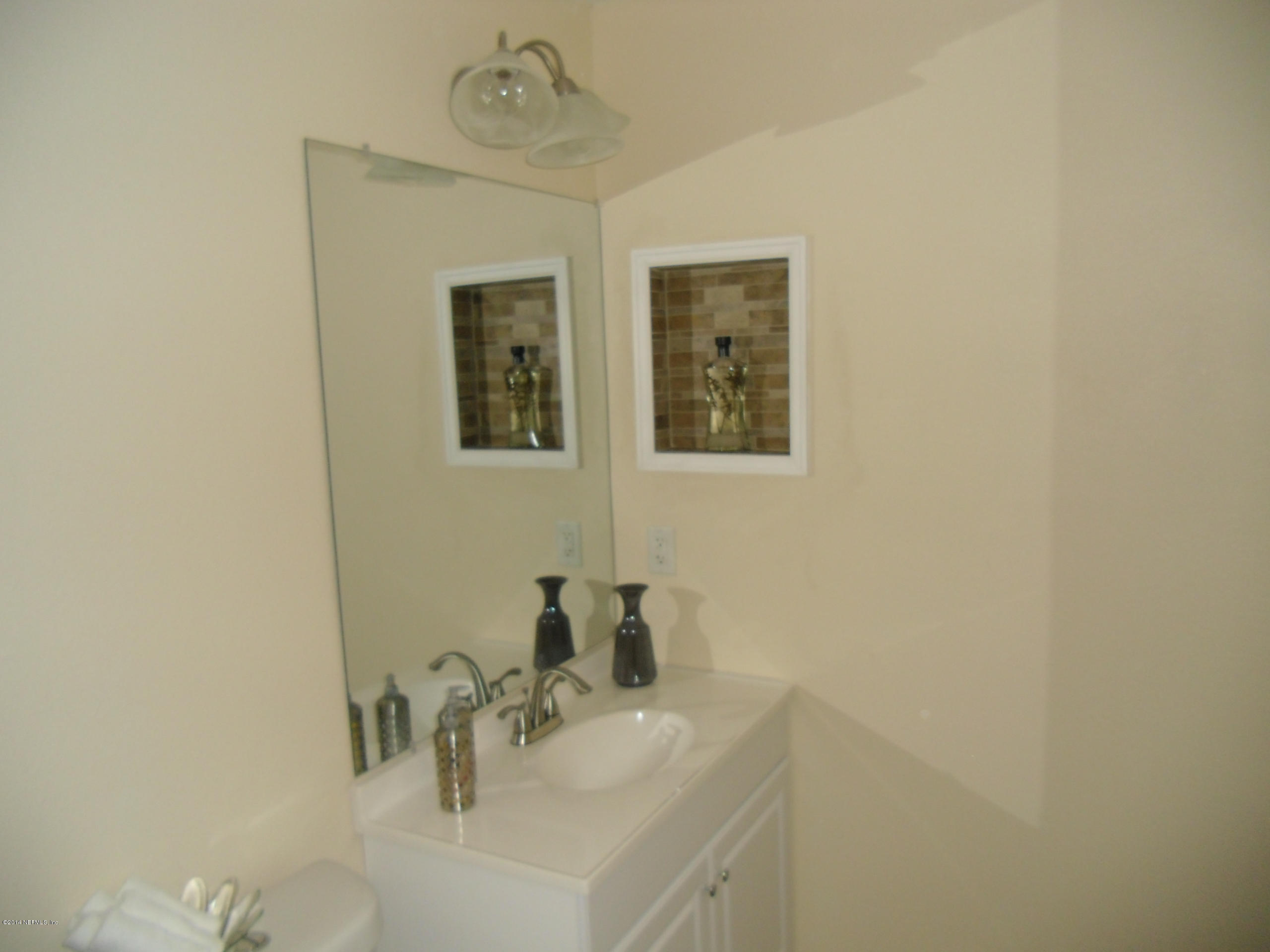 4221 Spring Park Road Jacksonville, FL 32207 - Photo 44 of 56 a bathroom with a sink and a mirror