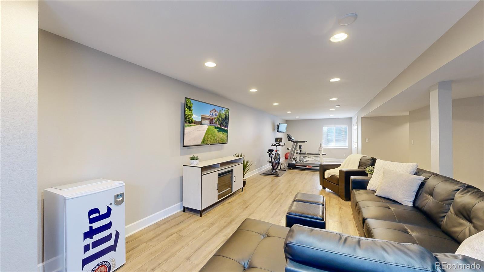 5759 Canyon Circle Longmont, CO 80504 - Photo 21 of 37 a living room with furniture and a flat screen tv