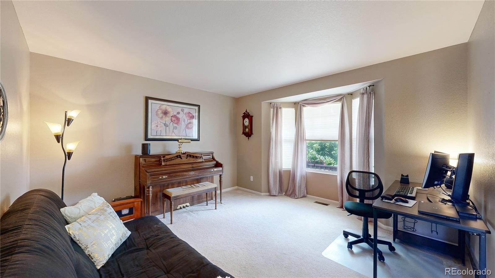5759 Canyon Circle Longmont, CO 80504 - Photo 26 of 37 a bedroom with a workspace