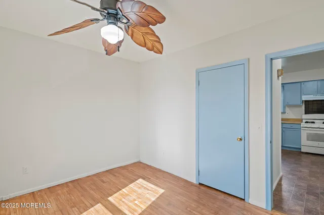 a view of a room with wooden floor sink and closet