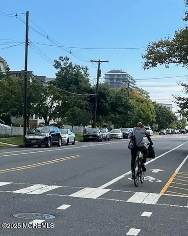 a view of a street with cars