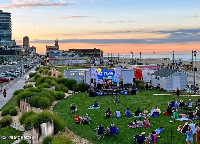 a view of a bunch of flowers in front of house