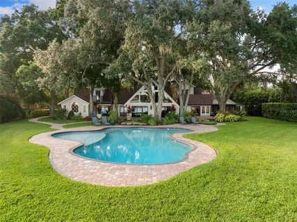 a view of a lake with houses in the back