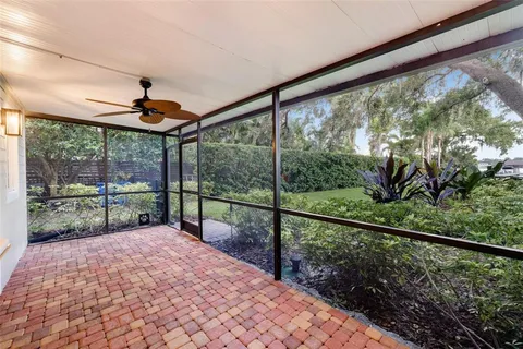 a view of a house with swimming pool and sitting area