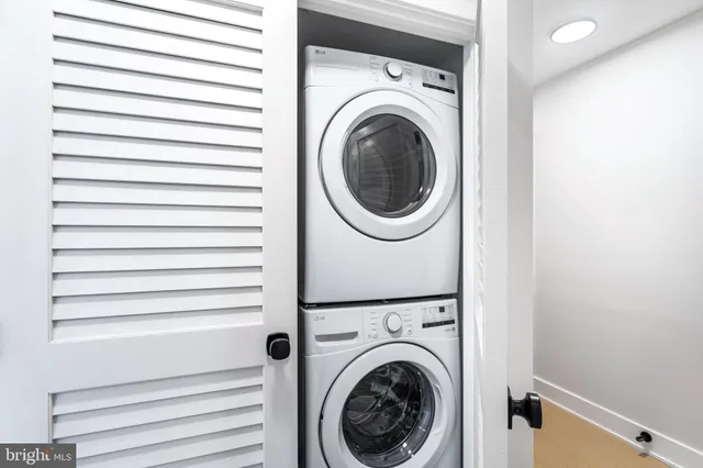a view of a hallway with washer and dryer