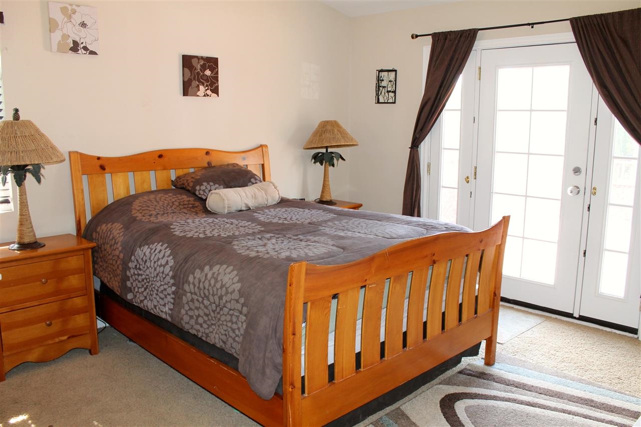 1418 Henshaw Road Oceanside, CA 92056 - Photo 14 of 25 Master Bedroom Features French Doors going out to a large deck over looking the backyard. It also has huge closets and master bath with seperate room for a toilet.