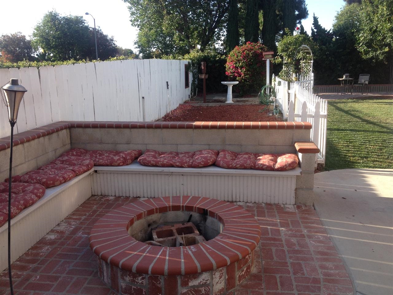 1418 Henshaw Road Oceanside, CA 92056 - Photo 21 of 25 L Shaped Sitting Area surrounding a wood fire pit.