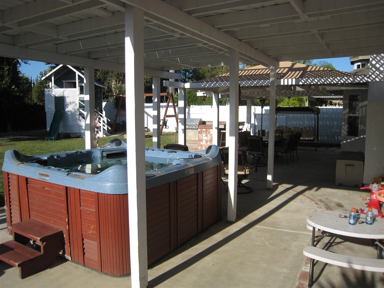 1418 Henshaw Road Oceanside, CA 92056 - Photo 23 of 25 A true entertainers backyard. Hot Tub, Fire Pit, Outdoor dining area, sitting area, covered patio, Bar, BBQ and a huge yard and Playhouse for the kids. What else could you want? Well there is room if you can think of it.