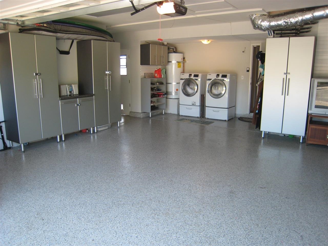 1418 Henshaw Road Oceanside, CA 92056 - Photo 24 of 25 This Garage has it all. Stailess Steel Cabinets and closets, the wall has built in grooves to hang tool holders, and it's finished off with epoxy floor covering. Enough room to work on that old dream car of yours.
