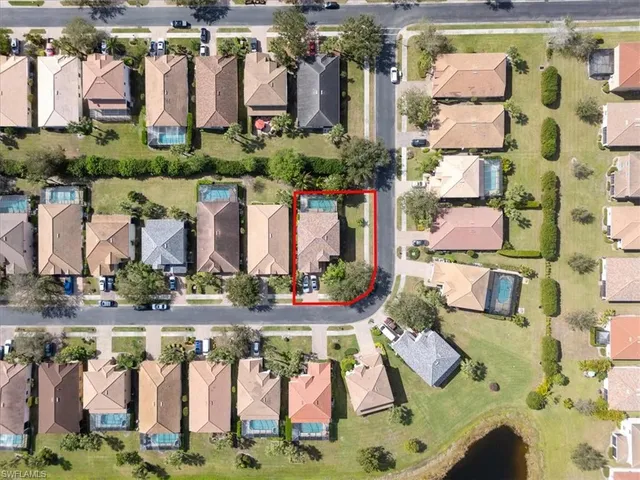 an aerial view of residential houses with outdoor space