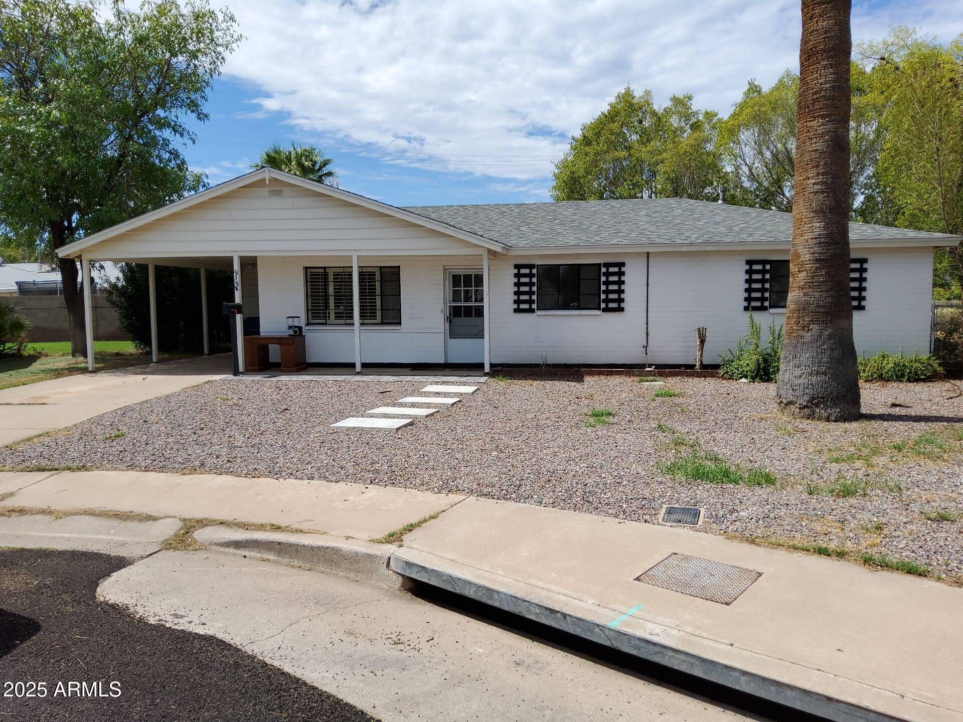 915 West 17th Place Tempe, AZ 85281 - Photo 1 of 13 a front view of a house with a yard