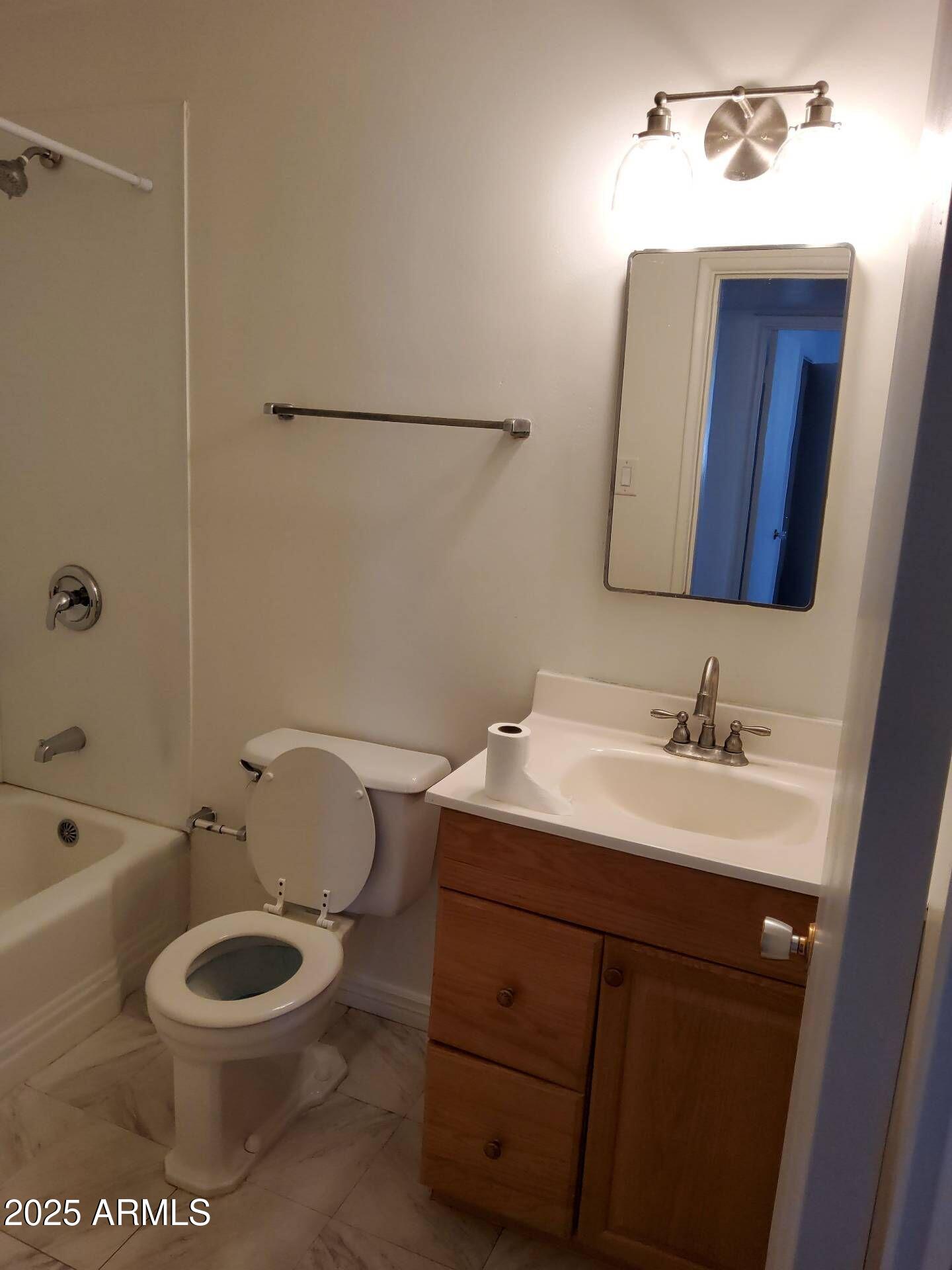 915 West 17th Place Tempe, AZ 85281 - Photo 10 of 13 a bathroom with a toilet a sink and bathtub