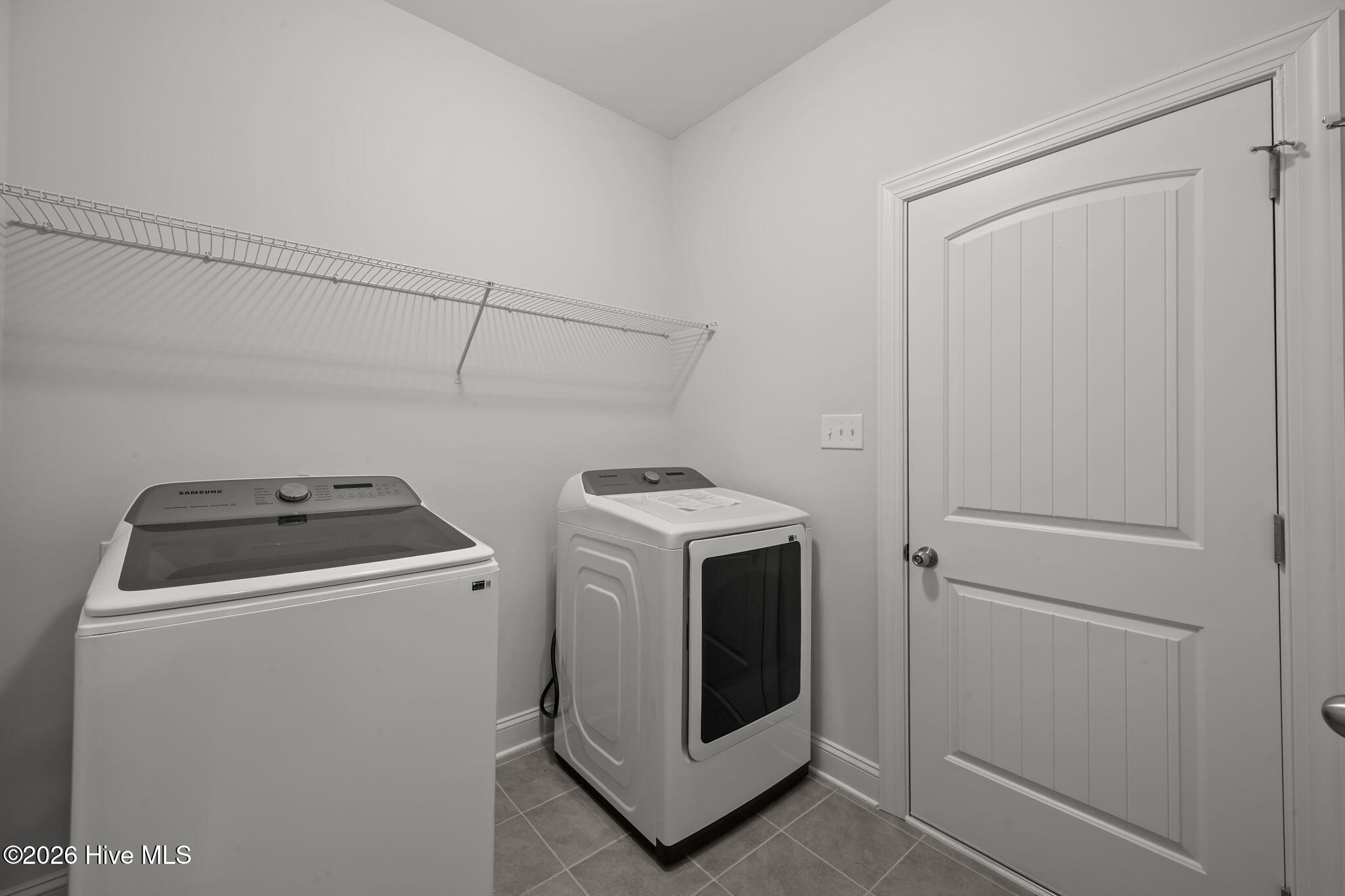 3002 Sharpnose Street New Bern, NC 28562 - Photo 30 of 53 Washer and dryer laundry area (7' x 7') off the garage entrance.