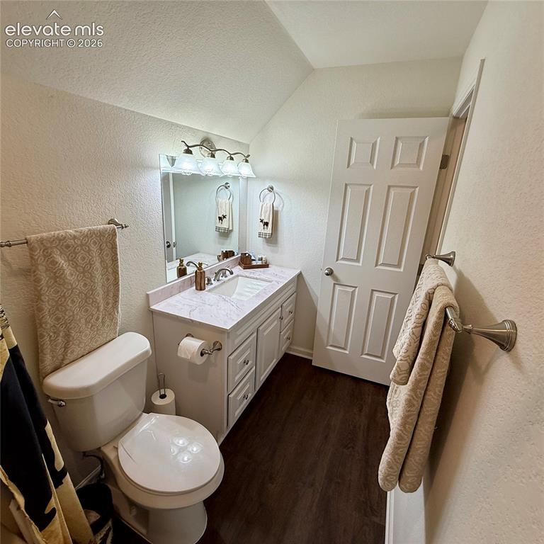 61 Stripling Lane Divide, CO 80814 - Photo 22 of 40 a bathroom with a sink a toilet a mirror and tub