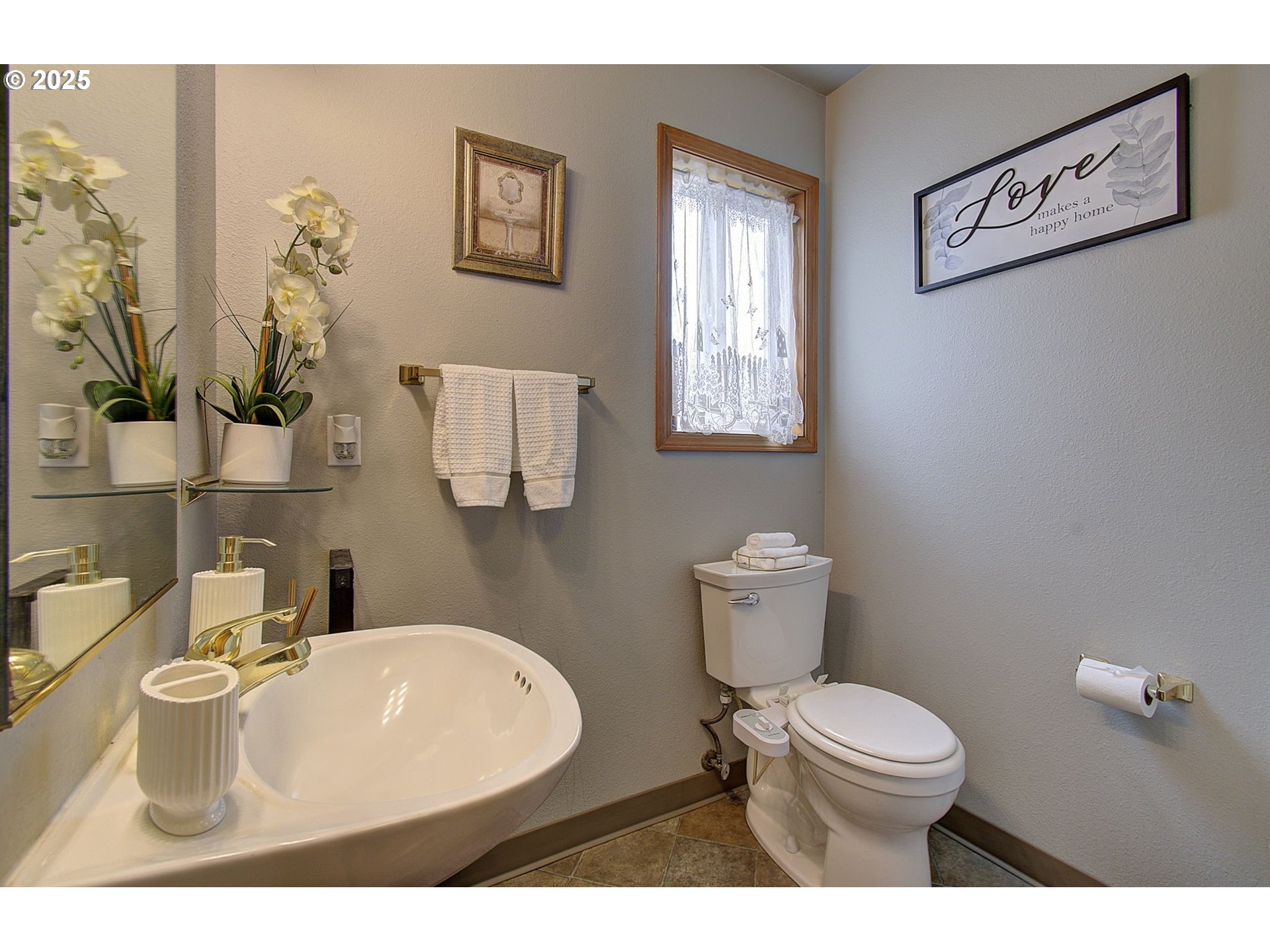 1758 Northwest 18th Court Gresham, OR 97030 - Photo 17 of 43 a bathroom with a toilet sink and mirror
