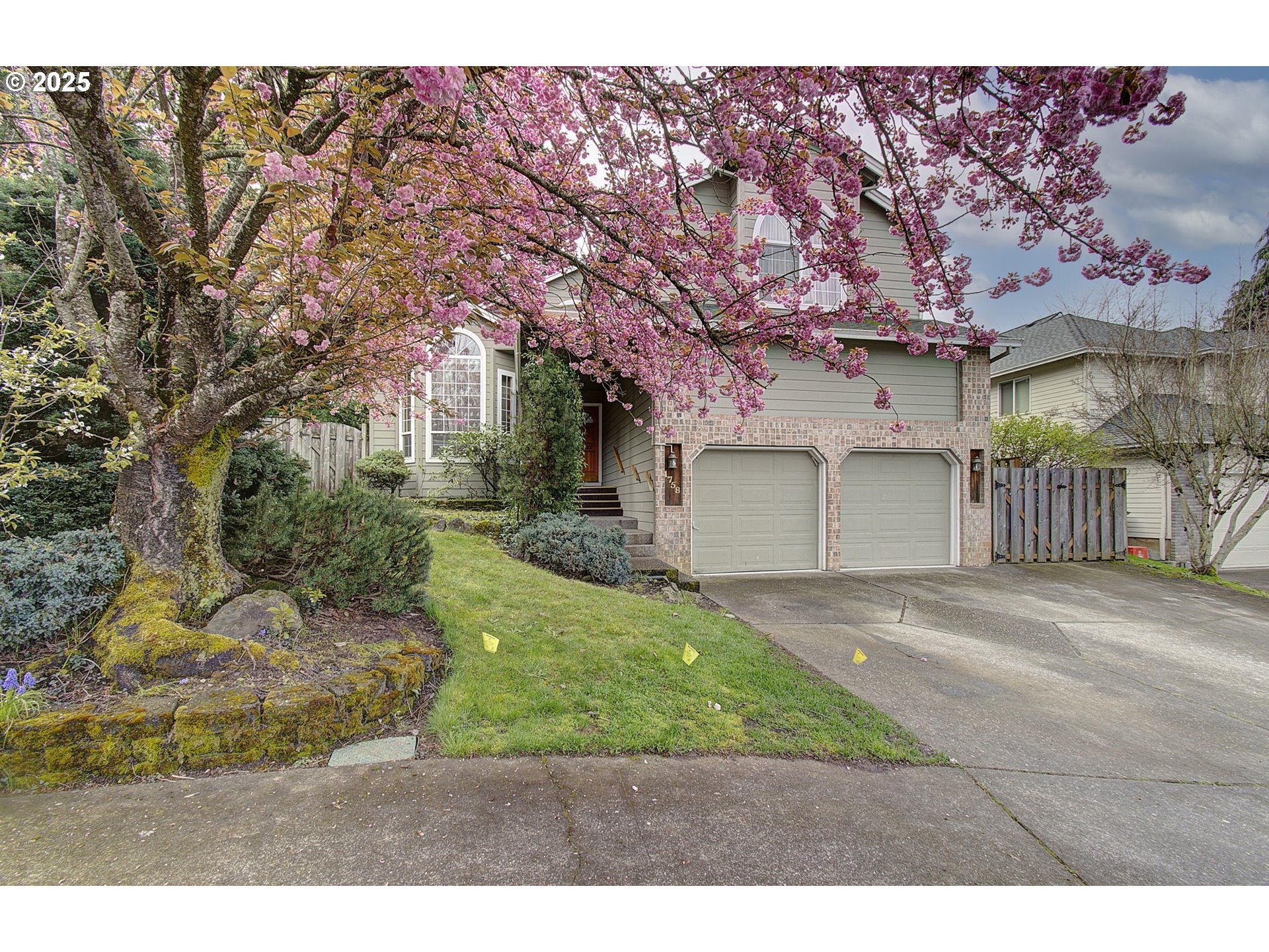 1758 Northwest 18th Court Gresham, OR 97030 - Photo 2 of 43 a front view of a house with a yard and garage