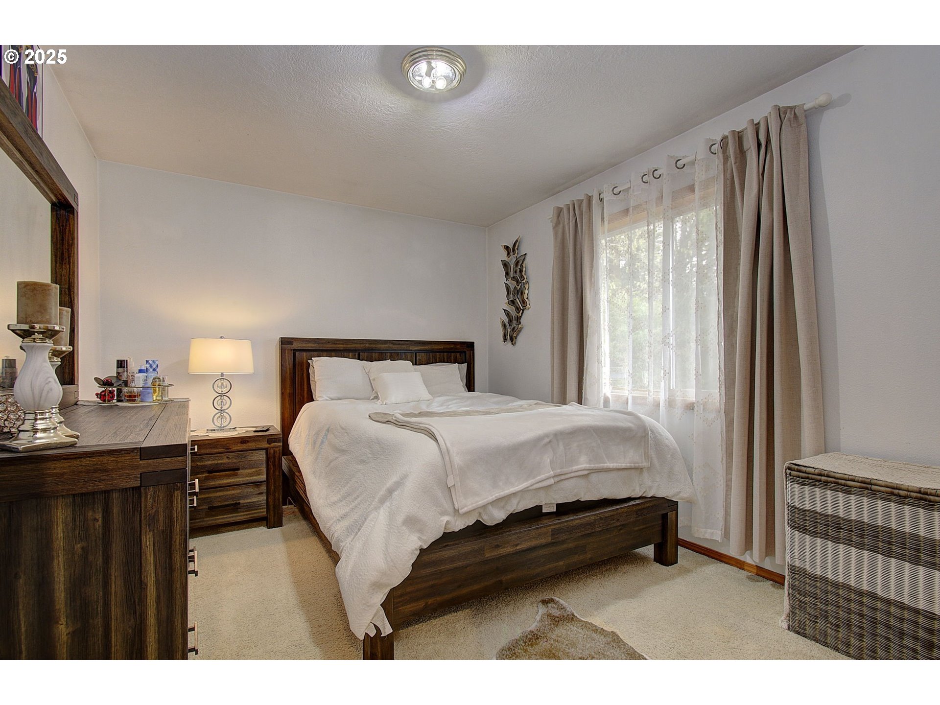 1758 Northwest 18th Court Gresham, OR 97030 - Photo 24 of 43 a bedroom with a bed and a night stand