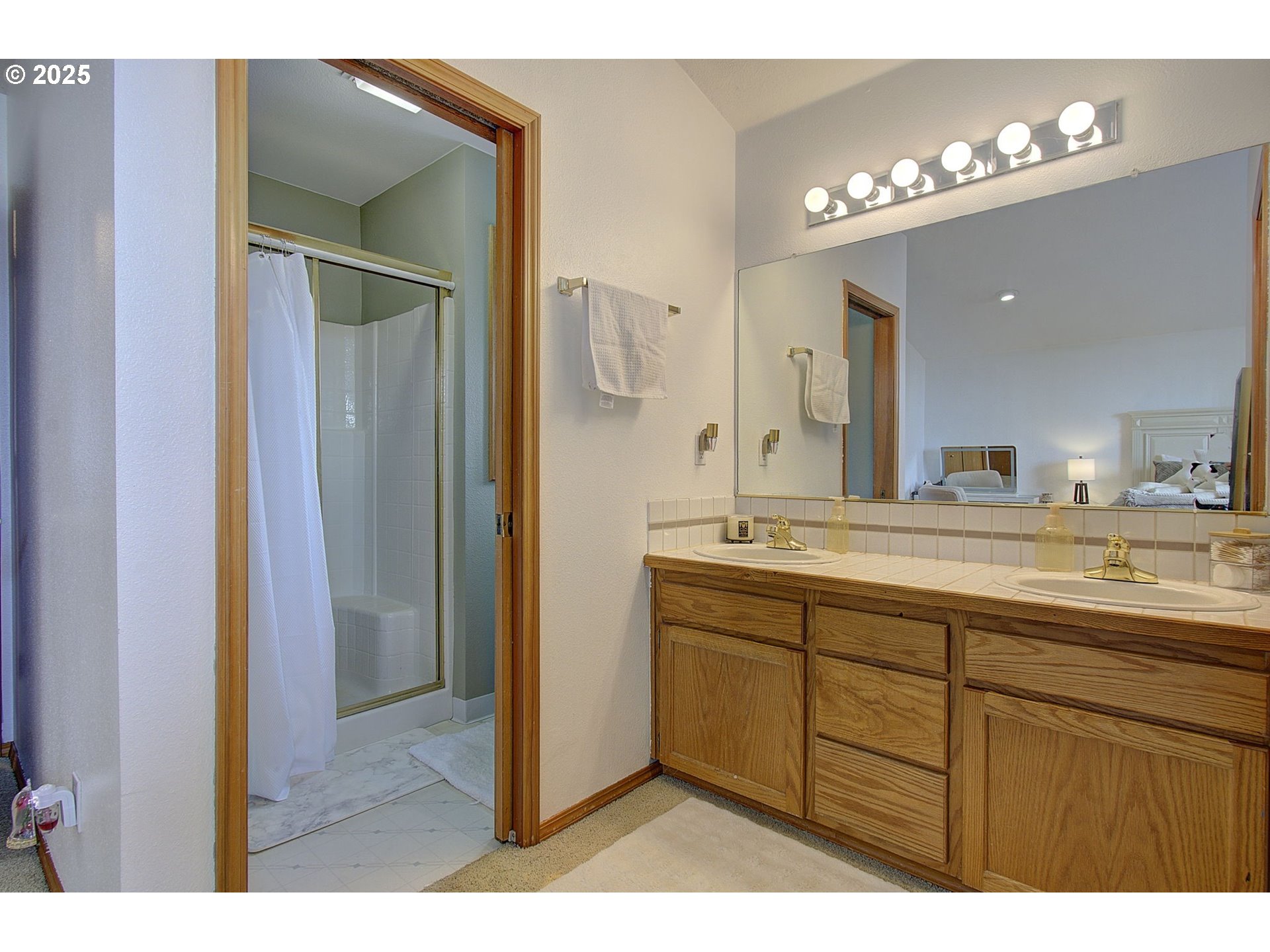 1758 Northwest 18th Court Gresham, OR 97030 - Photo 28 of 43 a bathroom with a double vanity sink and a mirror