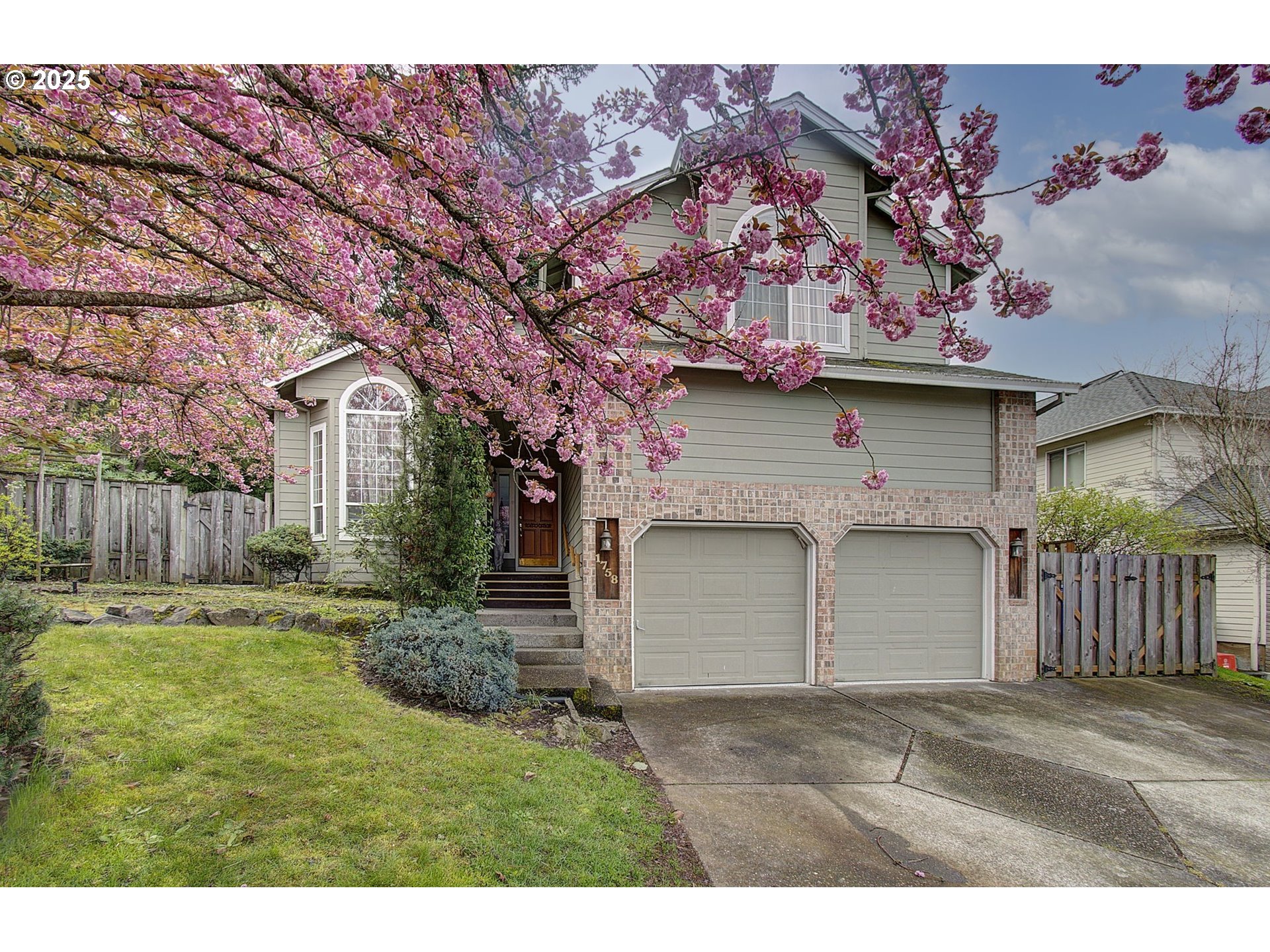 1758 Northwest 18th Court Gresham, OR 97030 - Photo 3 of 43 a front view of a house with a garden
