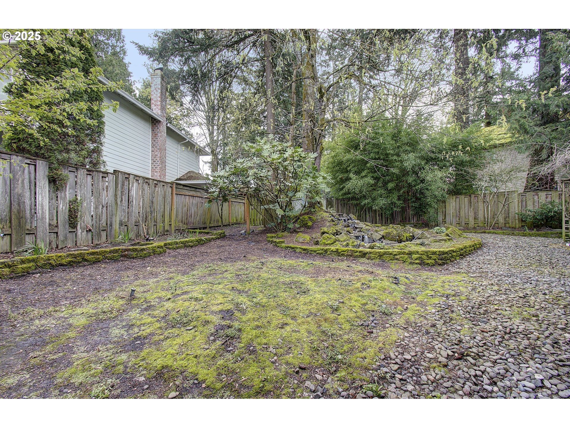 1758 Northwest 18th Court Gresham, OR 97030 - Photo 36 of 43 a view of a backyard with large trees