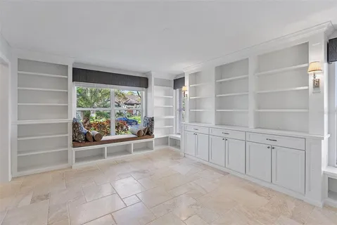 a bathroom with a granite countertop sink mirror and a bath tub