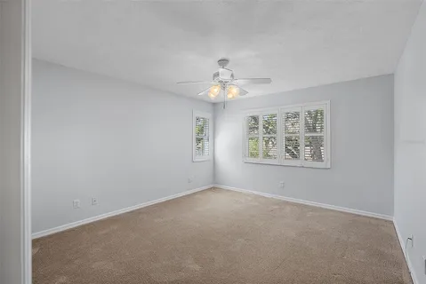 a view of a backyard with sitting area