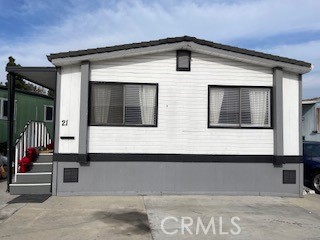 a front view of a house with large windows
