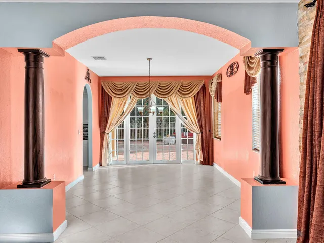 a kitchen with stainless steel appliances granite countertop a refrigerator and a stove