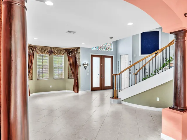 a bathroom with a shower a toilet and a sink