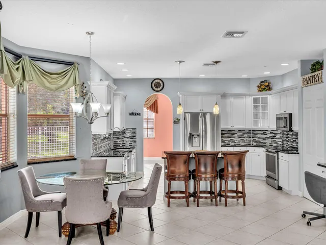 a front view of a house with a yard table and chairs