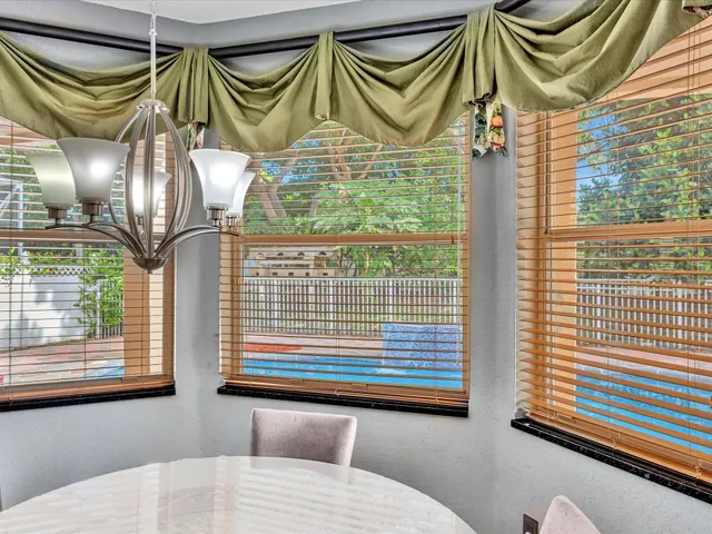 an aerial view of a houses with yard