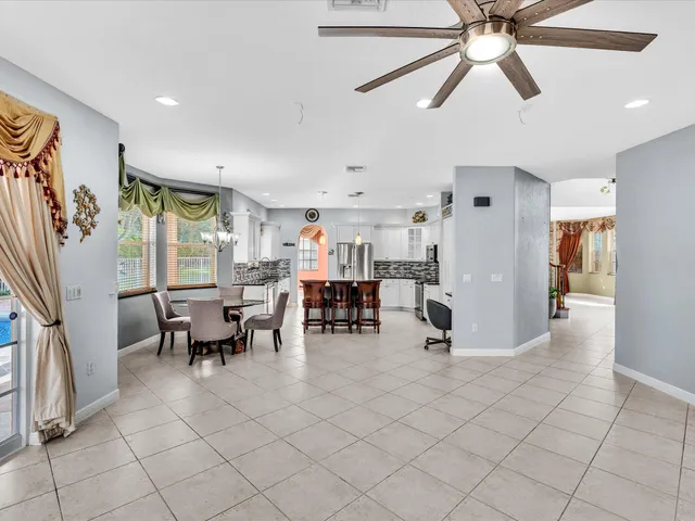 an aerial view of a house with a yard and lake view