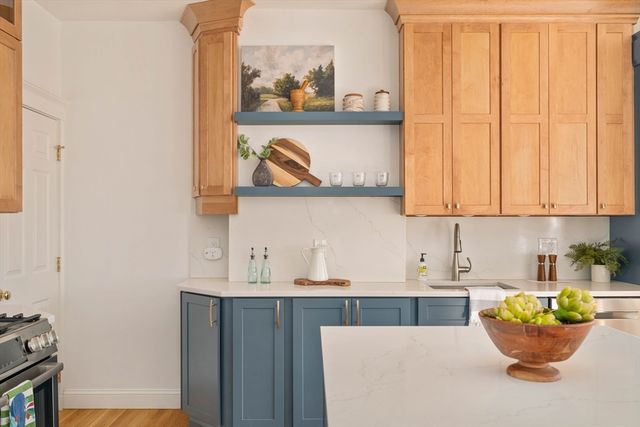 a kitchen with a sink and a microwave