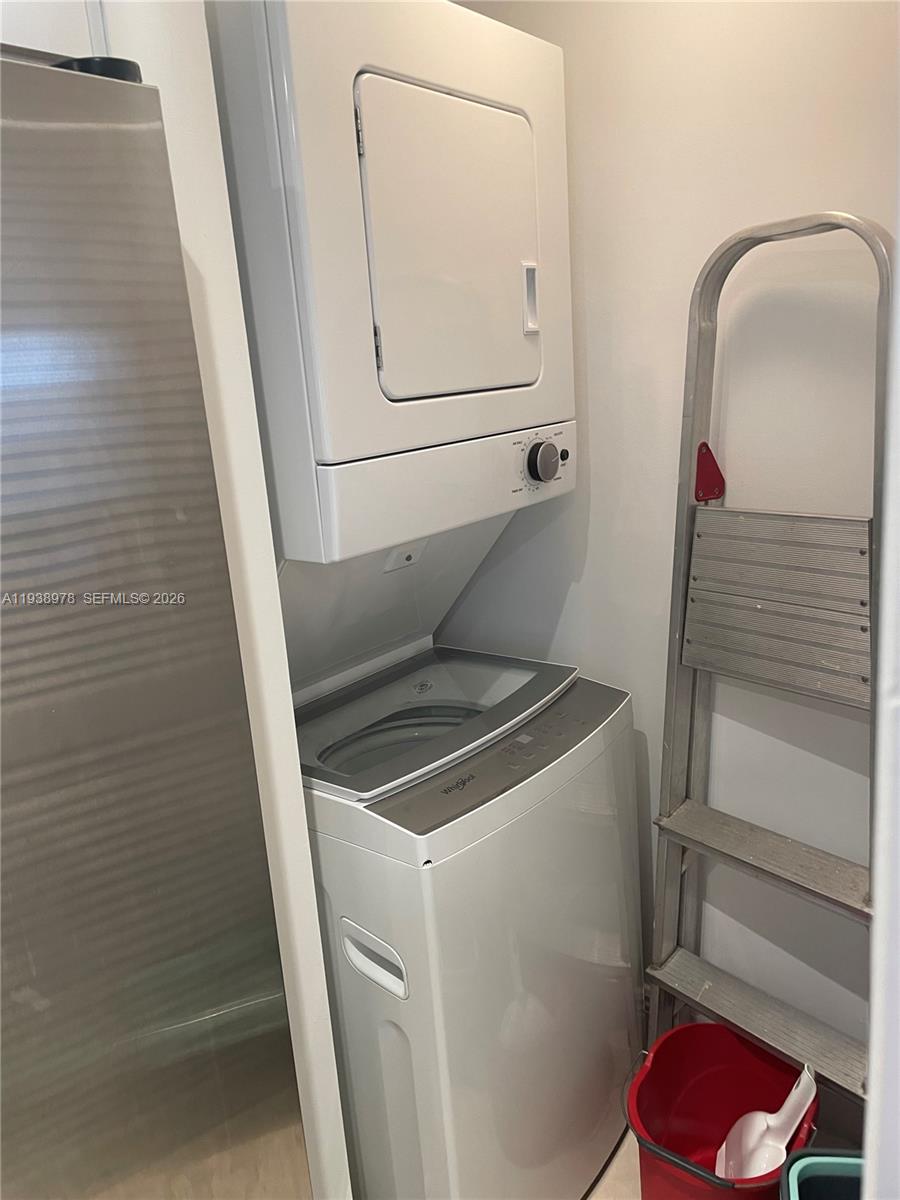 2351 Douglas Road, Unit 809 Miami, FL 33145 - Photo 13 of 14 a utility room with dryer and washer
