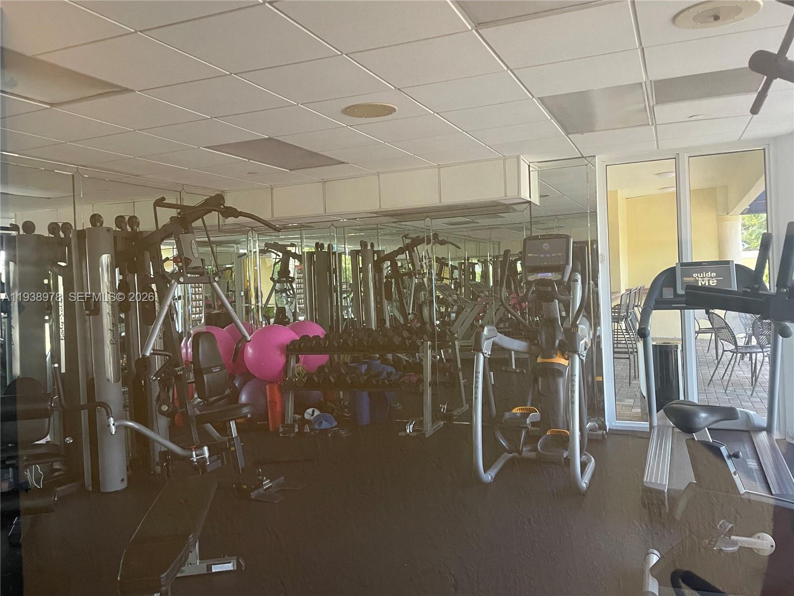 2351 Douglas Road, Unit 809 Miami, FL 33145 - Photo 14 of 14 a view of a room with gym equipment