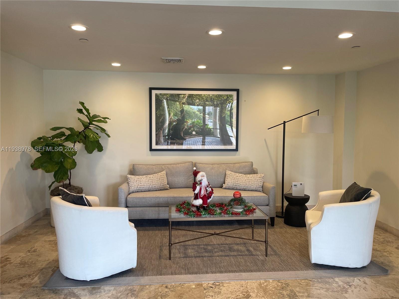 2351 Douglas Road, Unit 809 Miami, FL 33145 - Photo 4 of 14 a living room with furniture and a potted plant