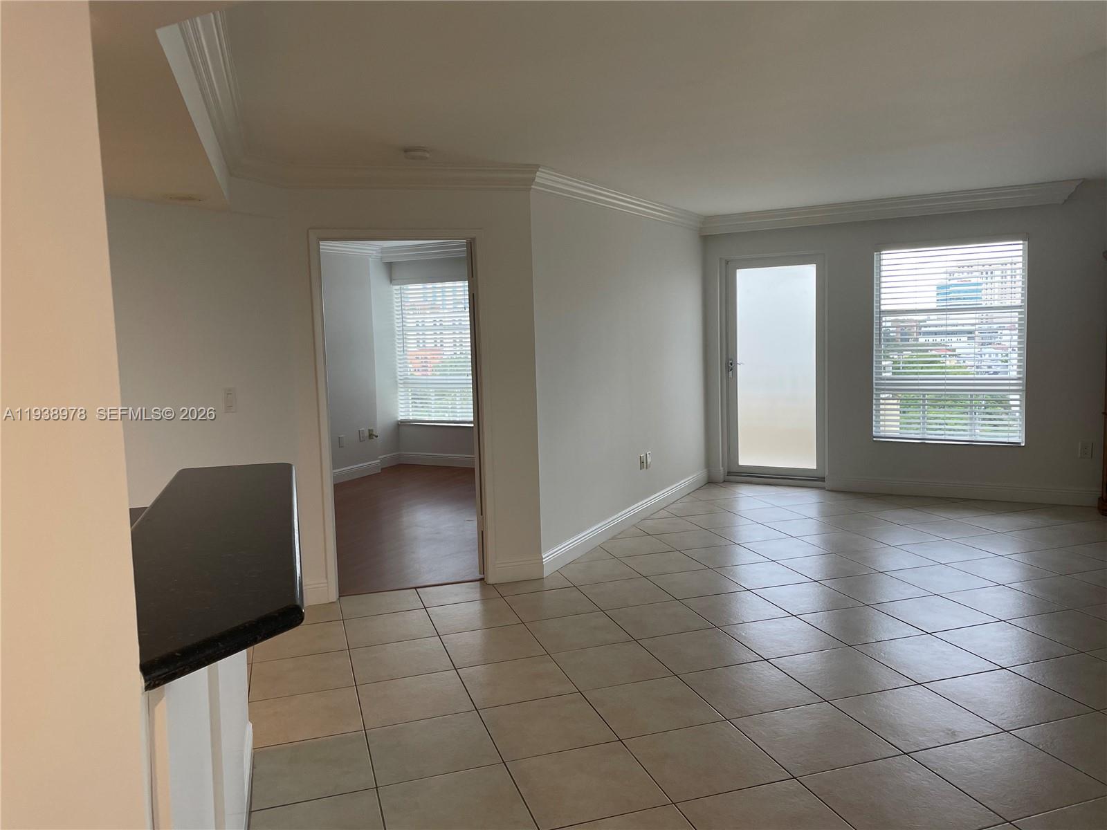 2351 Douglas Road, Unit 809 Miami, FL 33145 - Photo 10 of 14 a view of an empty room with a window