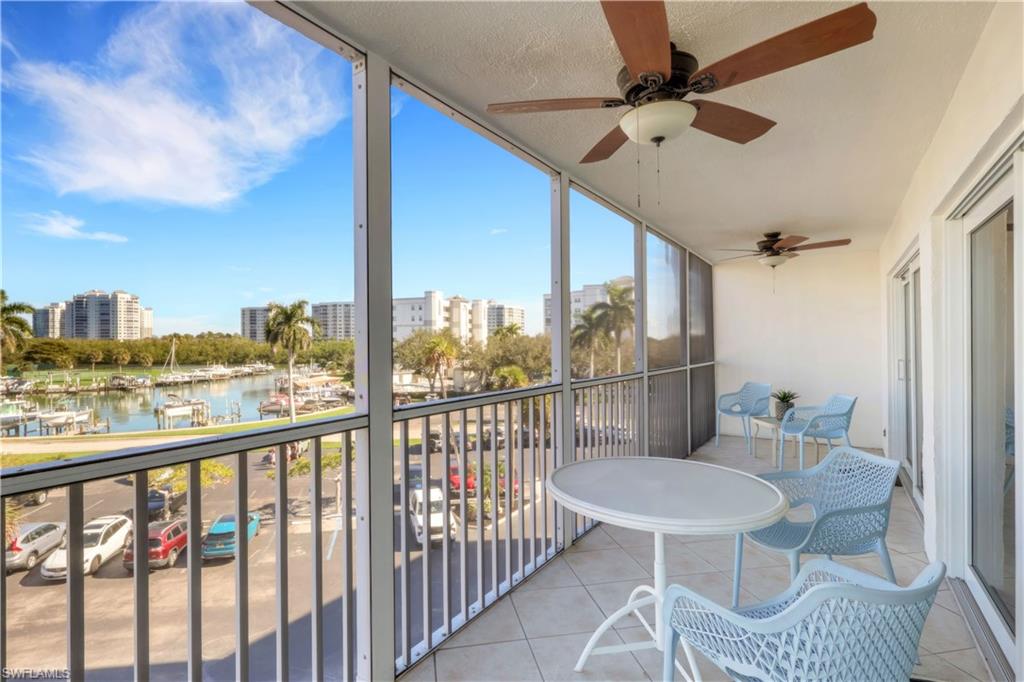 1 Bluebill Avenue, Unit 401 Naples, FL 34108 - Photo 26 of 35 a view of a balcony with furniture