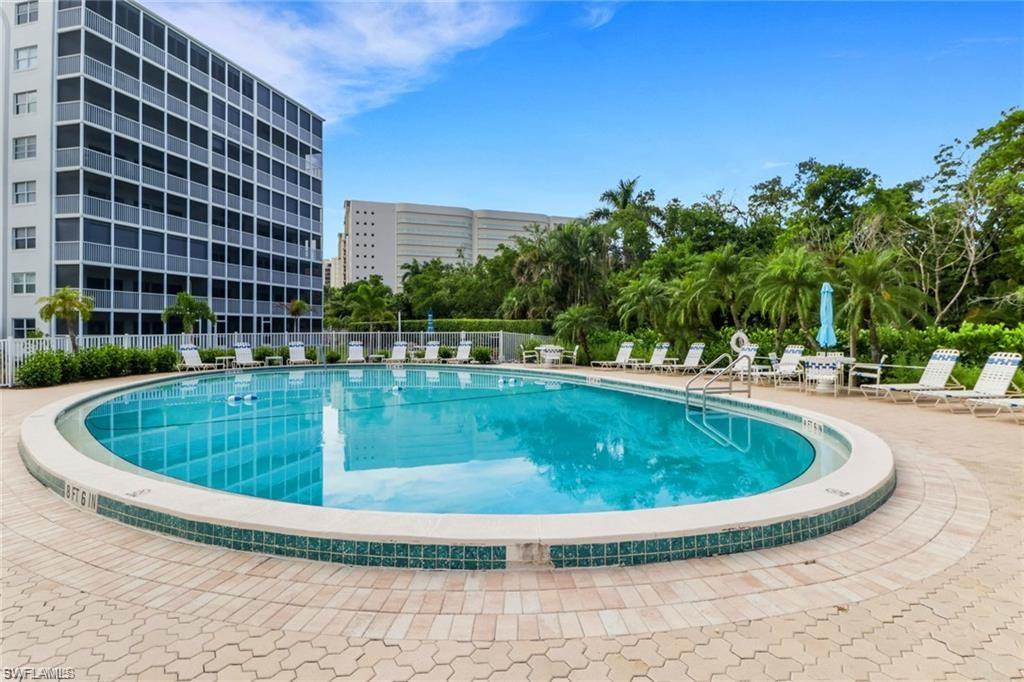 1 Bluebill Avenue, Unit 401 Naples, FL 34108 - Photo 28 of 35 a view of outdoor space yard swimming pool and patio