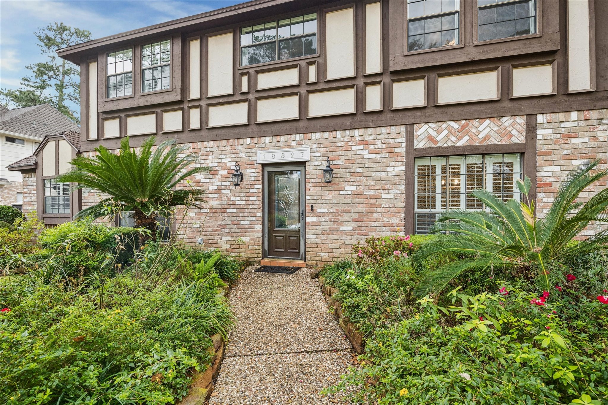 18327 Forest Elms Drive Spring, TX 77388 - Photo 2 of 30 front view of a brick house with a small yard