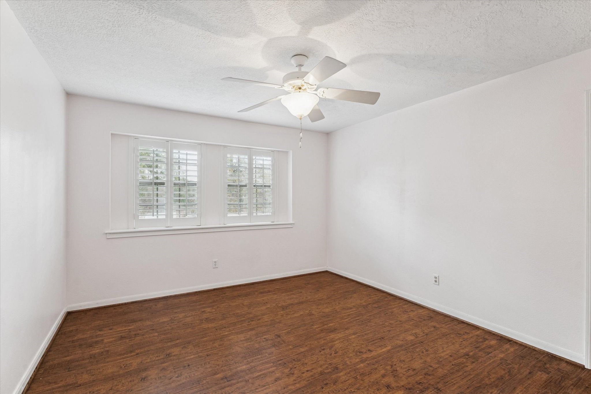 18327 Forest Elms Drive Spring, TX 77388 - Photo 24 of 30 an empty room with a window and a ceiling fan