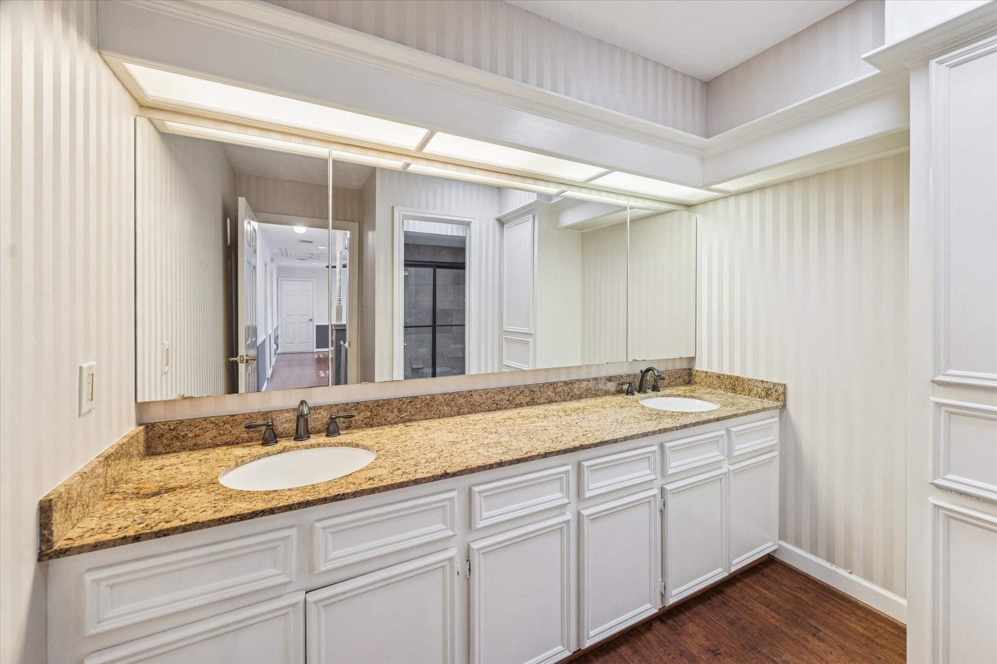 18327 Forest Elms Drive Spring, TX 77388 - Photo 25 of 30 a bathroom with a granite countertop sink and a mirror