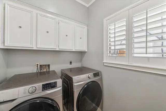 a utility room with dryer and washer
