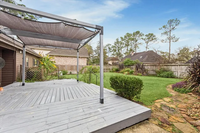 a view of a backyard with sitting area