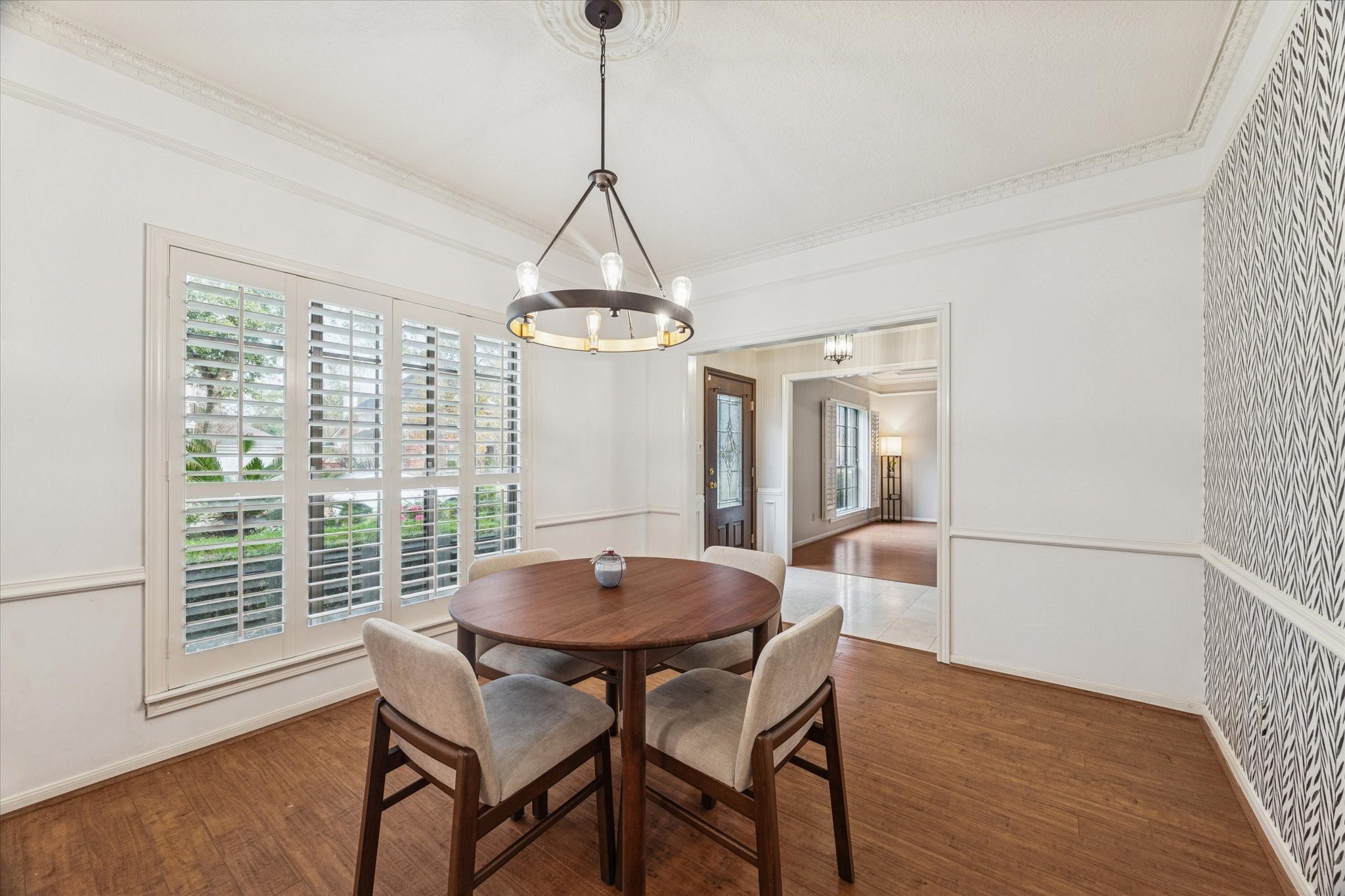18327 Forest Elms Drive Spring, TX 77388 - Photo 4 of 30 a view of a dining room with furniture window and wooden floor