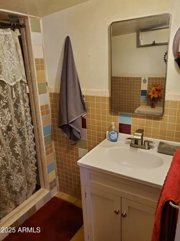 a bathroom with a sink and a mirror
