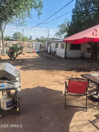 a living room with furniture a flat screen tv and a window