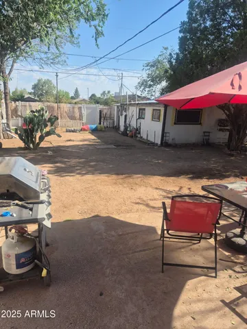 a living room with furniture a flat screen tv and a window