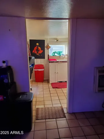 a kitchen with a sink and a stove top oven